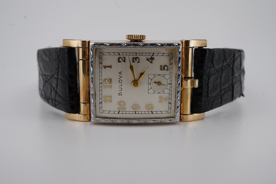 A gentleman's 10k gold filled Bulova manual wind wrist watch, with Arabic dial and subsidiary seconds, case diameter 22mm, on a later associated leather strap. Condition - fair to good.